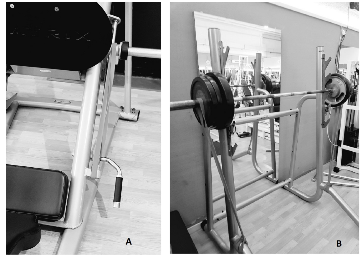 Barbell loaded with resistance bands — bands looped from the bar down to the base of the squat rack, adding progressive tension through the concentric phase